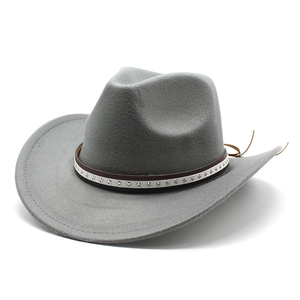 Detail of grey felt cowboy hat featuring brown leather band with silver star metal studs