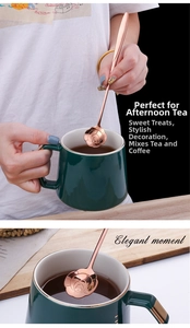 Detail view of long-handle rose gold flower spoon paired with ceramic cup for tea