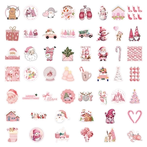 Close-up of pink and white Christmas stickers featuring Santa, snowman and gingerbread man