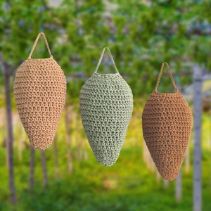 Handmade crochet strawberry shaped hanging baskets for kitchen fruit and veggie storage