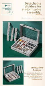 Close-up of the gray velvet jewelry box with adjustable dividers and clear glass lid