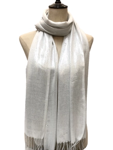 Close-up of silver scarf texture with metallic shimmer finish and delicate fringe details