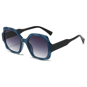 Bohemian oversized square sunglasses with blue faceted frame and purple gradient lenses