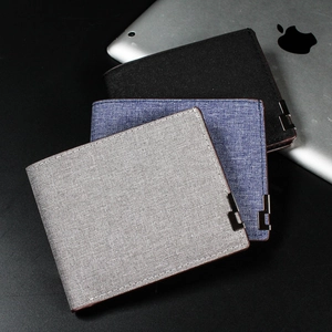 Men's short canvas bifold wallets in grey, blue, and black with leather trim detail
