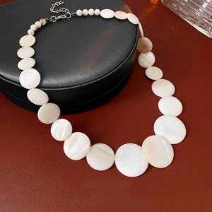 Modern geometric shell beaded necklace with pearlescent gradient and silver clasp