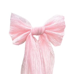 Pink pleated tulle triple bow for wedding backdrop and festive holiday decorations