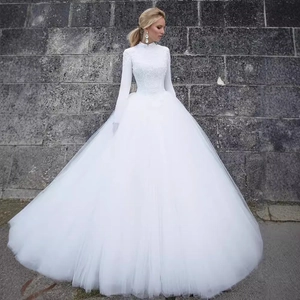 Elegant white lace long sleeve wedding dress with high neck and voluminous tulle skirt