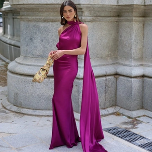 Detail of elegant one shoulder fuchsia satin dress with matching long neck scarf accessory
