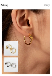 Detail view of 316L stainless steel knotted hoop earrings in gold and silver finishes