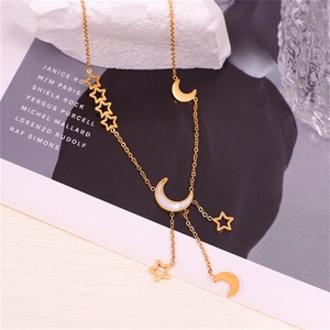 Elegant gold celestial necklace with mother-of-pearl moon and hollow star charms