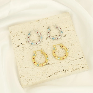Polished titanium steel hoop earrings with inlaid colorful stones in gold and silver finish
