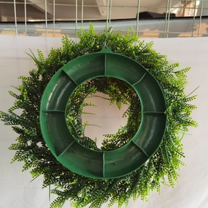 Detailed back view of the Easter wreath showing the sturdy plastic green foliage structure
