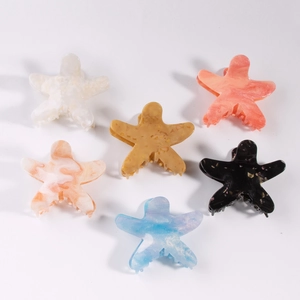 Set di sei mollette per capelli a forma di stella marina in acetato marmorizzato