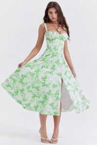 Detail of French floral slip dress with green patterns and a high side slit feature