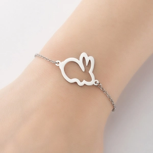 Elegant stainless steel rabbit pendant bracelet for women on a model wrist