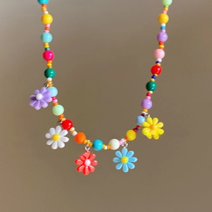 Colorful daisy bead necklace with vibrant flower charms and dopamine style accents
