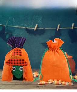 Green witch applique on orange velvet Halloween candy bag with drawstring and candy corn