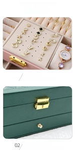 Detail of multi-tier jewelry box with earring display board and golden metal lock