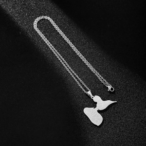 Detailed view of silver stainless steel Guadeloupe map pendant with engraved texture