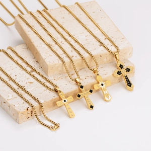 Golden stainless steel cross necklaces with enamel and rhinestones on stone pedestals