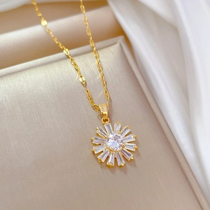 Detailed macro view of the gold sunflower pendant necklace with zircon stone setting