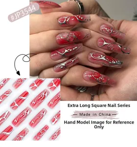 Detail of red and black gradient long square fake nails with silver metallic stripes
