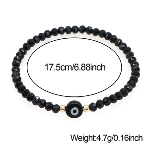 Bracelet élastique œil maléfique avec perles noires et dorées, longueur 17,5cm et 4,7g