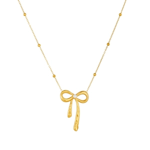Collier avec pendentif nœud doré, perle blanche et chaîne à billes au design épuré