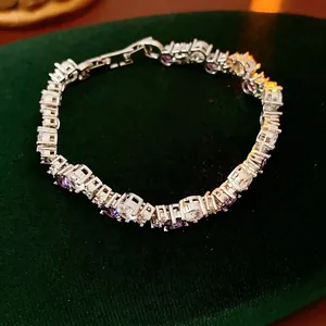 Exquisite silver tennis bracelet with purple and white cubic zirconia stones in claw setting