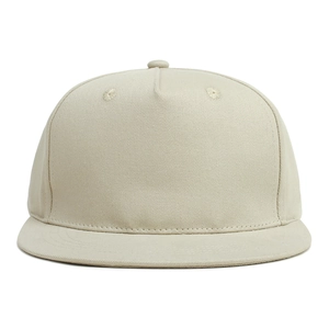 Detail of a beige flat brim kids baseball cap showing twill cotton texture and eyelets