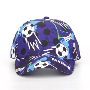 Detailed close-up of soccer themed graphic print on a purple baseball cap for kids