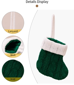 Detail display of green knitted Christmas stocking with lanyard and textured knit details