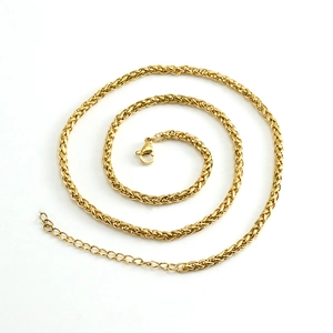 Detail of golden stainless steel wheat chain with secure lobster clasp and extender