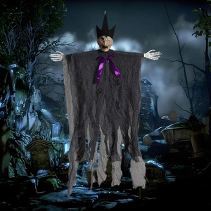 Hanging Halloween ghost with purple bowtie and black hat in a foggy graveyard setting