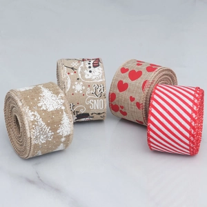 Detail of Christmas plaid burlap ribbons with snowman, snowflakes and red heart patterns