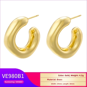 Detailed close-up showing gold chunky hoop earrings dimensions of 29mm by 30mm