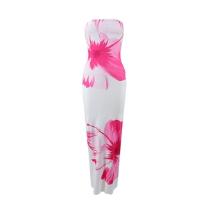 Close-up of pink floral pattern on a slim-fit strapless white maxi vacation dress