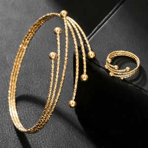 Elegant gold-tone multi-layer open cuff bracelet and matching ring set with ball ends