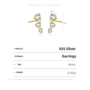 Macro detail of S925 silver earrings with three-stone zircon studs measuring 8mm in length