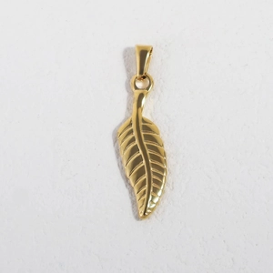Macro shot of 24K gold plated leaf pendant made of stainless steel with a metallic finish