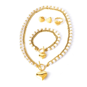 Golden double-layer pearl jewelry set with heart pendants including necklace and earrings