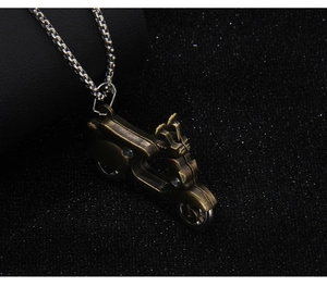 Close-up of vintage bronze scooter pendant on silver chain with realistic 3D details