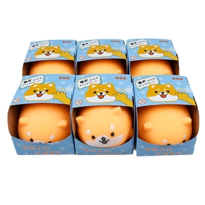 Set of six orange Shiba Inu squeeze toys in blue boxes for stress relief and fun