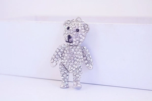 Close-up of a silver crystal bear keychain with sparkling rhinestones and black eyes