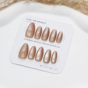 Handmade translucent champagne cat eye press-on nails in medium long almond shape