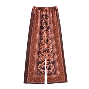 Women's boho chic set featuring wide-leg trousers with symmetrical ethnic patterns