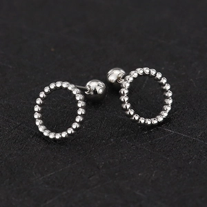 Macro view of silver stainless steel beaded hoop earrings with secure screw-on ball backings