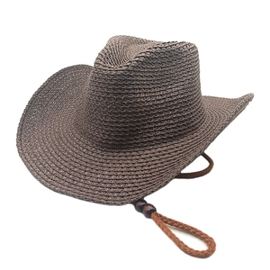 Detailed view of a dark coffee woven cowboy hat with adjustable chin strap and wooden beads