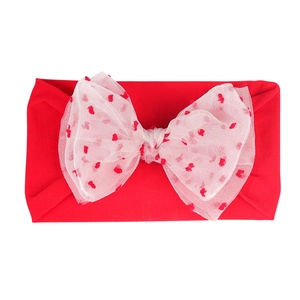 Elastic baby headband with red knit band and pink mesh bow with heart patterns