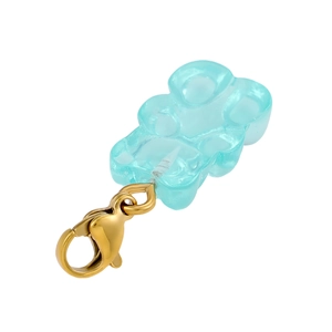 Macro detail of translucent blue resin bear pendant with polished gold metal lobster clasp